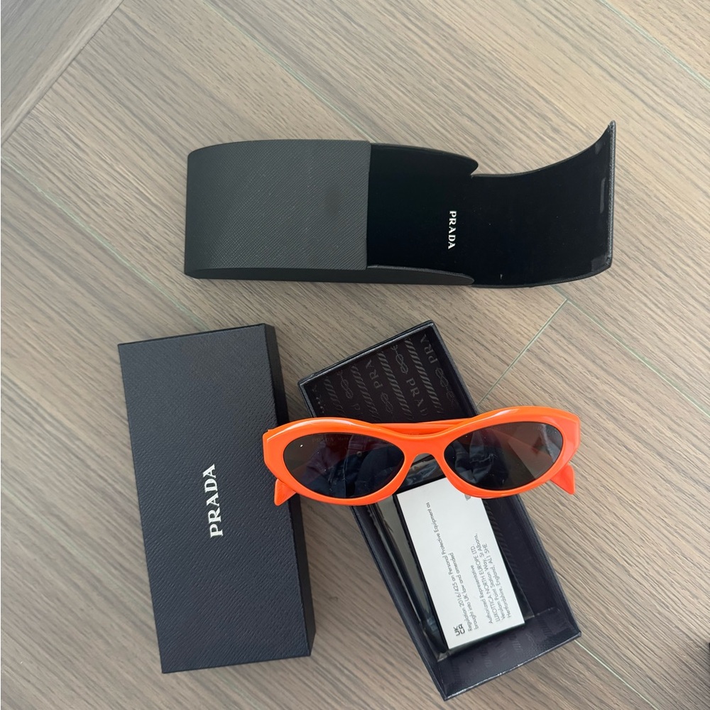 New without tags Prada cat eye in orange